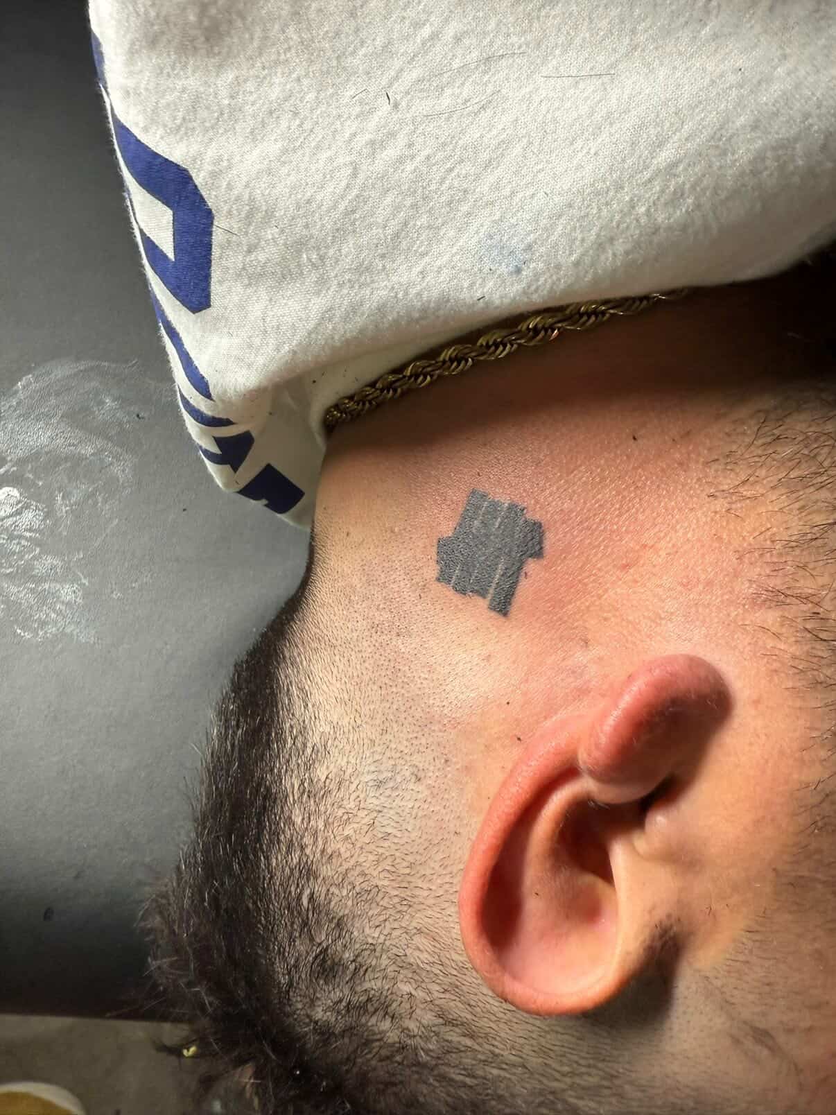 Undefeated Logo Tattoo